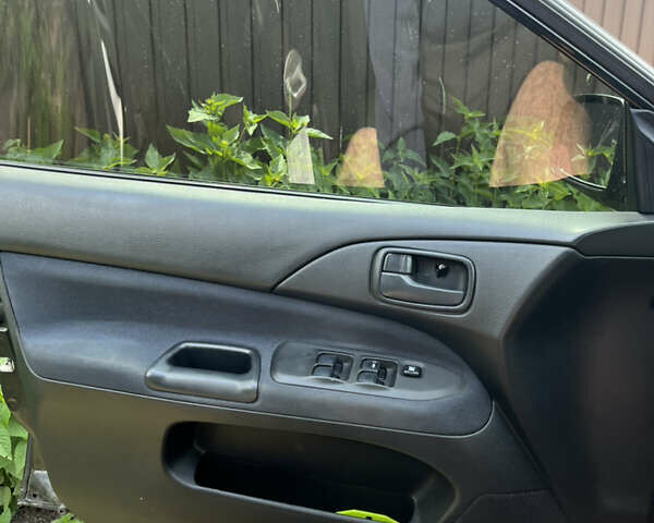 Чорний Міцубісі Lancer, об'ємом двигуна 1.59 л та пробігом 150 тис. км за 5500 $, фото 10 на Automoto.ua