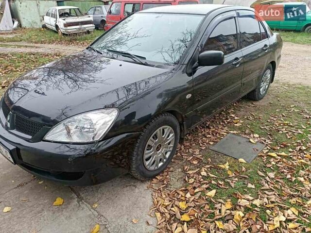 Чорний Міцубісі Lancer, об'ємом двигуна 1.58 л та пробігом 227 тис. км за 4100 $, фото 5 на Automoto.ua