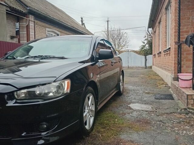 Чорний Міцубісі Lancer, об'ємом двигуна 2 л та пробігом 273 тис. км за 7100 $, фото 1 на Automoto.ua