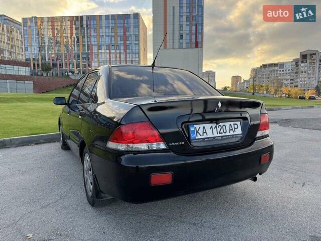Черный Мицубиси Лансер, объемом двигателя 1.58 л и пробегом 237 тыс. км за 3950 $, фото 4 на Automoto.ua