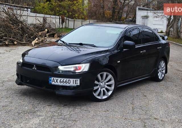 Черный Мицубиси Лансер, объемом двигателя 2 л и пробегом 230 тыс. км за 7100 $, фото 9 на Automoto.ua