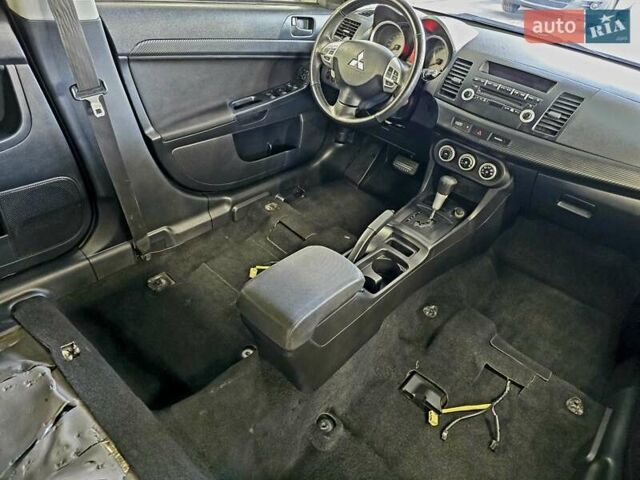 Черный Мицубиси Лансер, объемом двигателя 2 л и пробегом 260 тыс. км за 6555 $, фото 47 на Automoto.ua