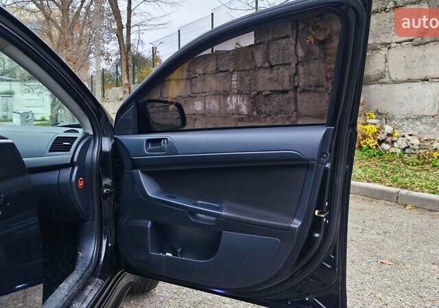 Черный Мицубиси Лансер, объемом двигателя 2 л и пробегом 230 тыс. км за 7100 $, фото 6 на Automoto.ua