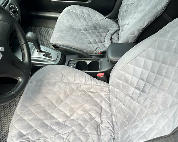 Чорний Міцубісі Lancer, об'ємом двигуна 1.59 л та пробігом 150 тис. км за 5500 $, фото 12 на Automoto.ua