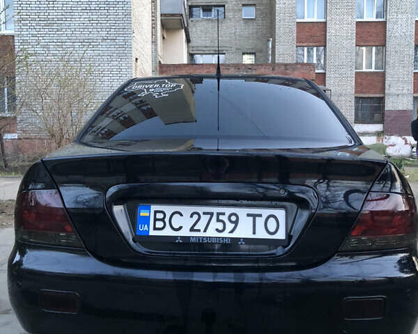 Черный Мицубиси Лансер, объемом двигателя 1.58 л и пробегом 230 тыс. км за 3600 $, фото 13 на Automoto.ua