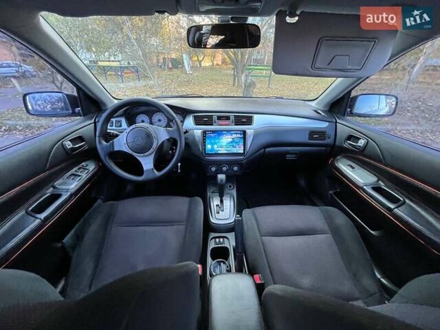 Черный Мицубиси Лансер, объемом двигателя 2 л и пробегом 280 тыс. км за 5400 $, фото 10 на Automoto.ua