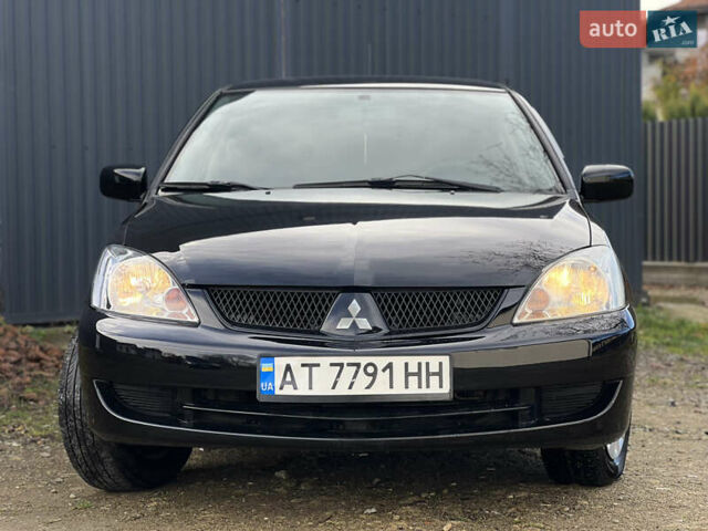 Чорний Міцубісі Lancer, об'ємом двигуна 1.58 л та пробігом 185 тис. км за 3750 $, фото 1 на Automoto.ua