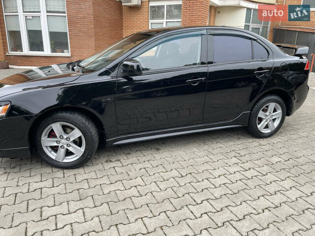 Черный Мицубиси Лансер, объемом двигателя 2 л и пробегом 200 тыс. км за 6199 $, фото 2 на Automoto.ua