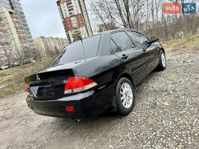 Черный Мицубиси Лансер, объемом двигателя 1.6 л и пробегом 216 тыс. км за 4990 $, фото 4 на Automoto.ua