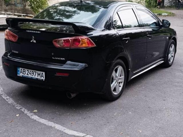 Черный Мицубиси Лансер, объемом двигателя 2 л и пробегом 210 тыс. км за 6000 $, фото 2 на Automoto.ua