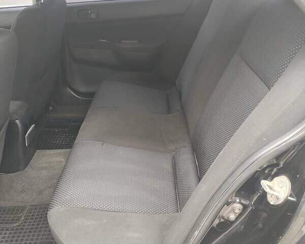 Чорний Міцубісі Lancer, об'ємом двигуна 1.58 л та пробігом 190 тис. км за 3750 $, фото 14 на Automoto.ua
