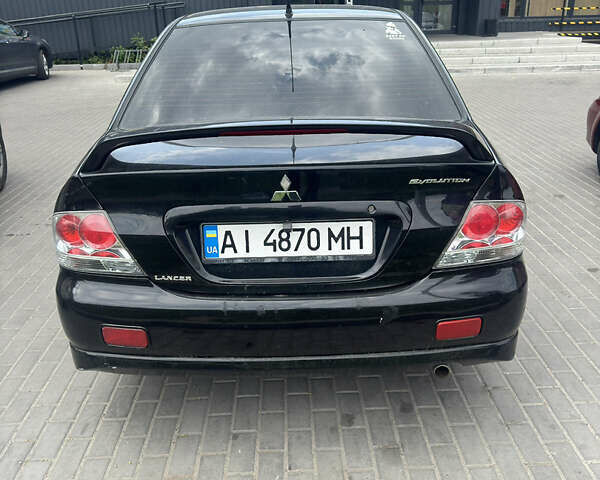 Чорний Міцубісі Lancer, об'ємом двигуна 2 л та пробігом 210 тис. км за 5500 $, фото 35 на Automoto.ua