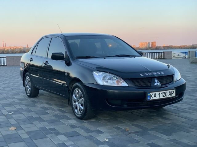 Черный Мицубиси Лансер, объемом двигателя 1.6 л и пробегом 237 тыс. км за 4300 $, фото 1 на Automoto.ua