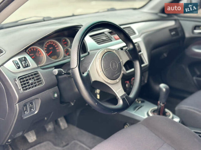 Чорний Міцубісі Lancer, об'ємом двигуна 2 л та пробігом 275 тис. км за 5300 $, фото 36 на Automoto.ua
