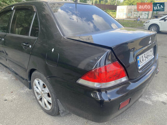 Чорний Міцубісі Lancer, об'ємом двигуна 1.6 л та пробігом 397 тис. км за 1500 $, фото 5 на Automoto.ua