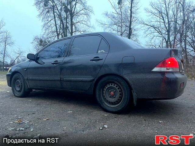Чорний Міцубісі Lancer, об'ємом двигуна 1.6 л та пробігом 201 тис. км за 4000 $, фото 6 на Automoto.ua