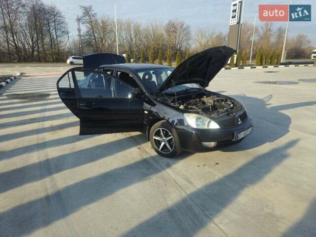 Чорний Міцубісі Lancer, об'ємом двигуна 1.59 л та пробігом 180 тис. км за 4999 $, фото 14 на Automoto.ua