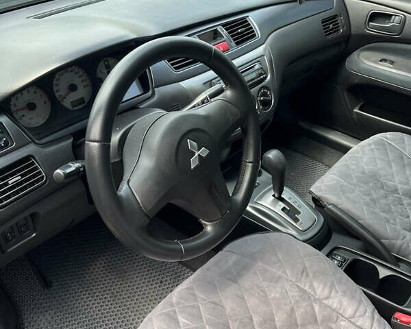 Чорний Міцубісі Lancer, об'ємом двигуна 1.59 л та пробігом 150 тис. км за 5500 $, фото 13 на Automoto.ua