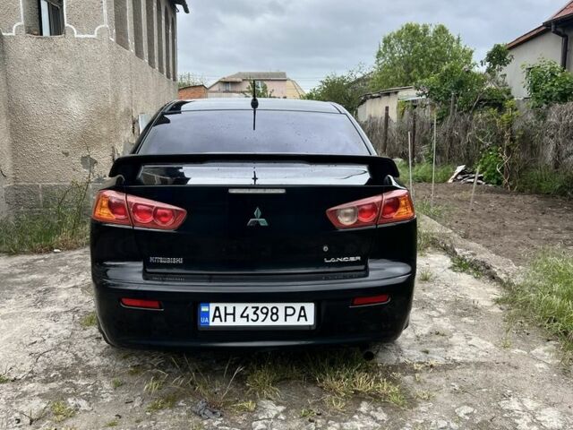 Черный Мицубиси Лансер, объемом двигателя 2 л и пробегом 200 тыс. км за 6900 $, фото 5 на Automoto.ua