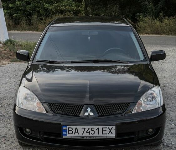 Черный Мицубиси Лансер, объемом двигателя 1.6 л и пробегом 226 тыс. км за 4800 $, фото 1 на Automoto.ua