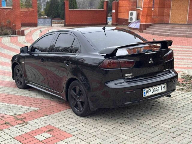 Черный Мицубиси Лансер, объемом двигателя 2 л и пробегом 217 тыс. км за 5500 $, фото 5 на Automoto.ua