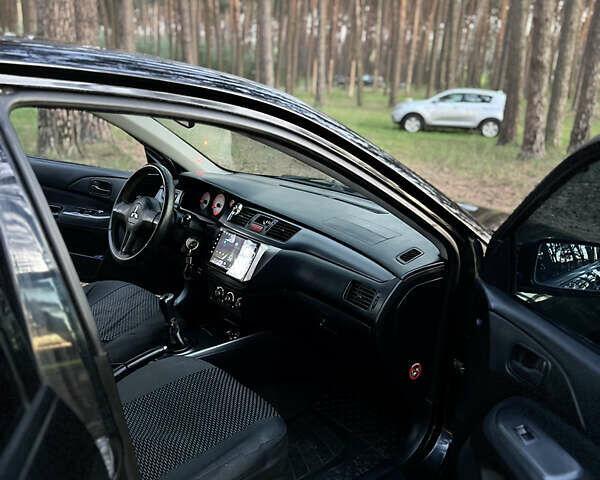 Чорний Міцубісі Lancer, об'ємом двигуна 1.58 л та пробігом 224 тис. км за 3900 $, фото 4 на Automoto.ua
