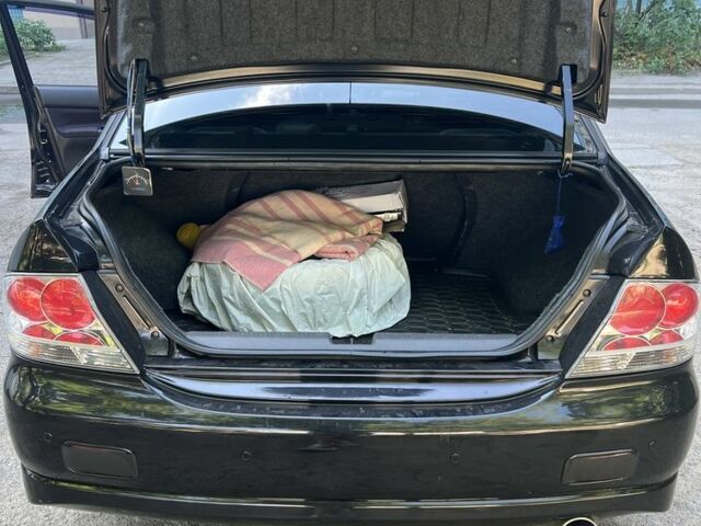 Черный Мицубиси Лансер, объемом двигателя 2 л и пробегом 240 тыс. км за 5600 $, фото 8 на Automoto.ua