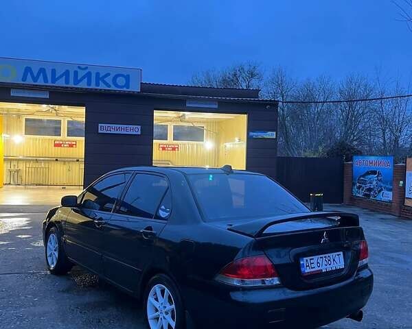 Черный Мицубиси Лансер, объемом двигателя 1.6 л и пробегом 249 тыс. км за 5000 $, фото 4 на Automoto.ua