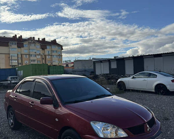 Чорний Міцубісі Lancer, об'ємом двигуна 1.6 л та пробігом 195 тис. км за 5000 $, фото 10 на Automoto.ua