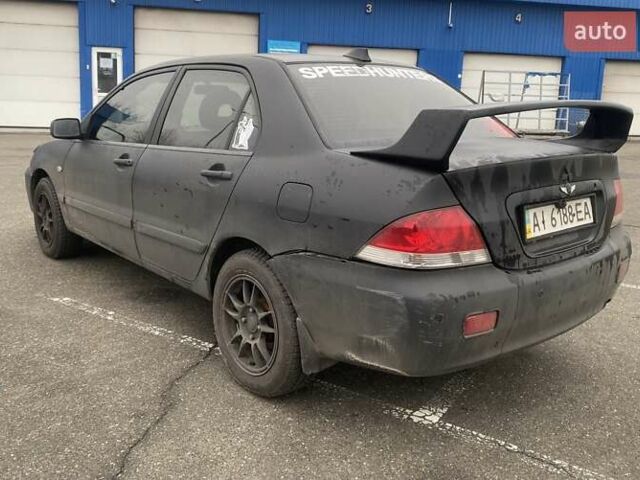 Черный Мицубиси Лансер, объемом двигателя 1.58 л и пробегом 263 тыс. км за 4000 $, фото 11 на Automoto.ua