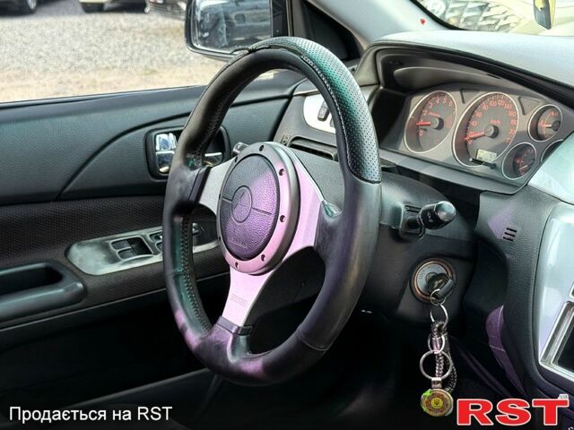 Черный Мицубиси Лансер, объемом двигателя 1.6 л и пробегом 260 тыс. км за 3700 $, фото 7 на Automoto.ua