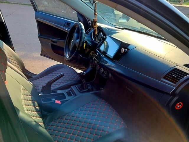 Черный Мицубиси Лансер, объемом двигателя 1.5 л и пробегом 215 тыс. км за 5600 $, фото 7 на Automoto.ua