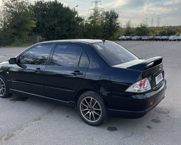 Чорний Міцубісі Lancer, об'ємом двигуна 2 л та пробігом 280 тис. км за 4600 $, фото 18 на Automoto.ua