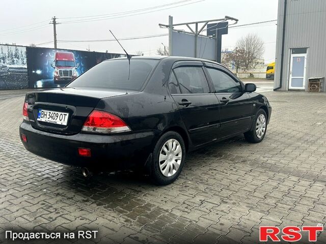 Чорний Міцубісі Lancer, об'ємом двигуна 1.6 л та пробігом 248 тис. км за 3950 $, фото 4 на Automoto.ua