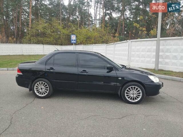 Чорний Міцубісі Lancer, об'ємом двигуна 1.58 л та пробігом 190 тис. км за 3750 $, фото 8 на Automoto.ua