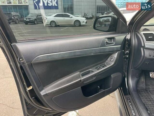 Черный Мицубиси Лансер, объемом двигателя 2 л и пробегом 246 тыс. км за 7500 $, фото 15 на Automoto.ua