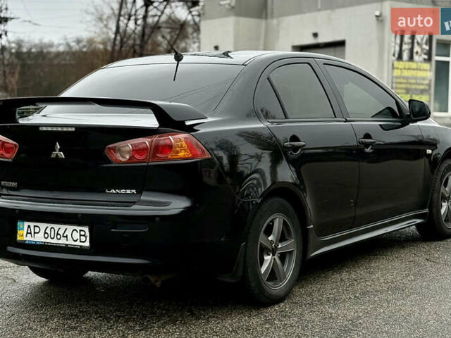 Черный Мицубиси Лансер, объемом двигателя 2 л и пробегом 215 тыс. км за 5500 $, фото 6 на Automoto.ua