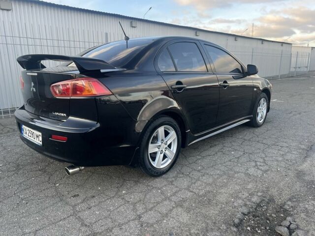 Черный Мицубиси Лансер, объемом двигателя 2 л и пробегом 170 тыс. км за 7900 $, фото 2 на Automoto.ua