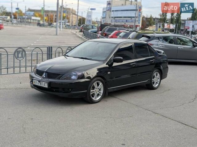 Чорний Міцубісі Lancer, об'ємом двигуна 2 л та пробігом 152 тис. км за 5500 $, фото 29 на Automoto.ua
