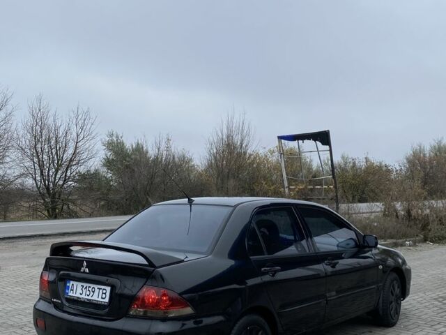 Черный Мицубиси Лансер, объемом двигателя 1.6 л и пробегом 263 тыс. км за 2900 $, фото 4 на Automoto.ua
