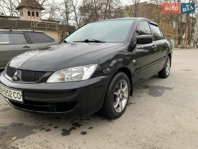 Черный Мицубиси Лансер, объемом двигателя 1.6 л и пробегом 164 тыс. км за 5200 $, фото 4 на Automoto.ua