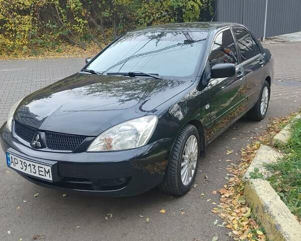 Чорний Міцубісі Lancer, об'ємом двигуна 1.58 л та пробігом 190 тис. км за 3750 $, фото 15 на Automoto.ua