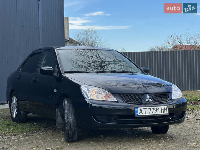 Чорний Міцубісі Lancer, об'ємом двигуна 1.58 л та пробігом 185 тис. км за 3750 $, фото 2 на Automoto.ua
