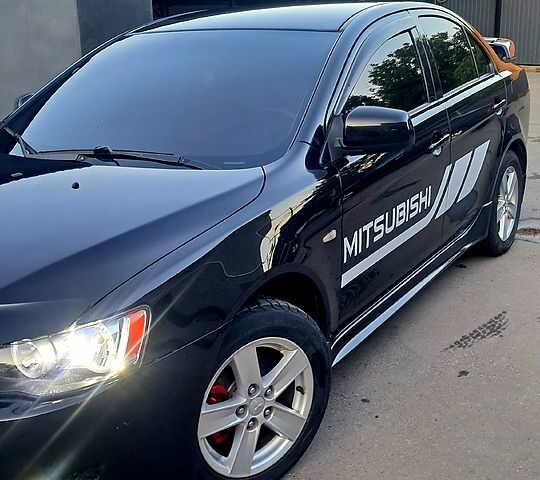 Черный Мицубиси Лансер, объемом двигателя 2 л и пробегом 170 тыс. км за 6800 $, фото 7 на Automoto.ua