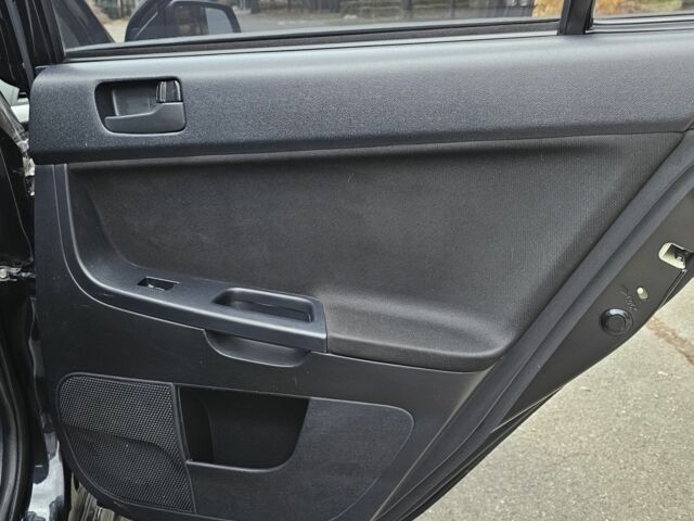 Черный Мицубиси Лансер, объемом двигателя 2 л и пробегом 115 тыс. км за 5000 $, фото 13 на Automoto.ua