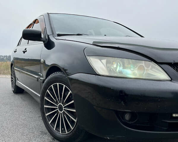 Чорний Міцубісі Lancer, об'ємом двигуна 1.6 л та пробігом 212 тис. км за 4700 $, фото 2 на Automoto.ua