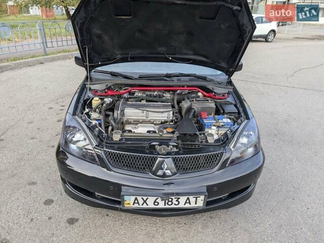 Чорний Міцубісі Lancer, об'ємом двигуна 2 л та пробігом 152 тис. км за 5500 $, фото 28 на Automoto.ua