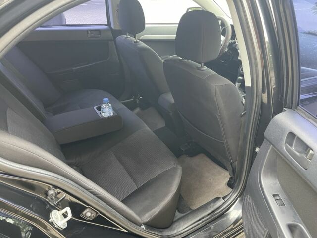 Чорний Міцубісі Lancer, об'ємом двигуна 2 л та пробігом 200 тис. км за 6800 $, фото 6 на Automoto.ua