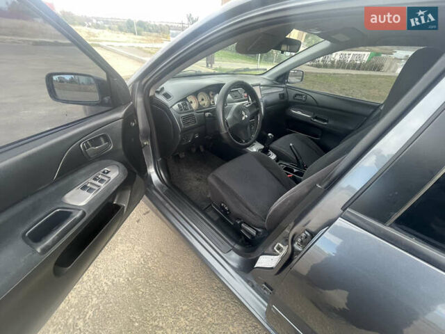 Чорний Міцубісі Lancer, об'ємом двигуна 1.6 л та пробігом 162 тис. км за 4650 $, фото 9 на Automoto.ua
