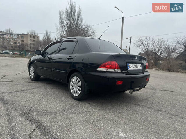 Чорний Міцубісі Lancer, об'ємом двигуна 1.58 л та пробігом 173 тис. км за 5099 $, фото 5 на Automoto.ua